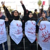 بالصور.. مظاهرة بـ«الأكفان» في المنصورة تطالب برحيل مرسي