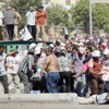«حماية الثورة» في «التحرير»... «سلمية» و«عودة الشرعية» في المحافظات... اشتباكات واقتحامات