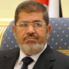 مرسي أمام المحكمة للمعتقلين: اثبت اثبت يا بطل!