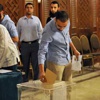 المصريون في الكويت يواصلون التصويت في اليوم الثاني للاستفتاء على الدستور