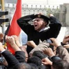 تظاهر أفراد شرطة النجدة بالمنيا