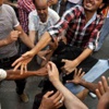اشتباكات بين متظاهري «الإخوان» والاشتراكيين الثوريين بالتحرير بسبب تأييد مرسي
