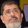 مرسي يتعهد بإعادة فتح قضايا ''شهداء ومصابي الثورة''