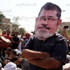 العشرات من أنصار مرسي يتظاهرون أعلى كوبري أكتوبر