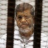 مرسي.. من كرسي الحكم إلى خلف قضبان السجن